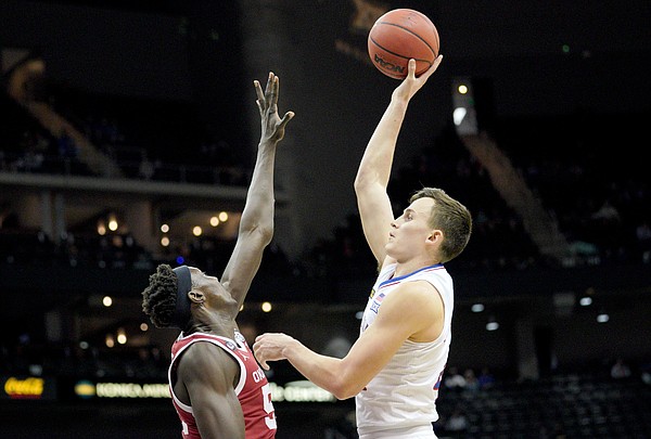 Kansas forward Mitch Lightfoot gets up a shot over Oklahoma during the Phillips 66 Big 12 Basketball Championship at the T-Mobile Center in Kansas City, Missouri on March 10, 2021.