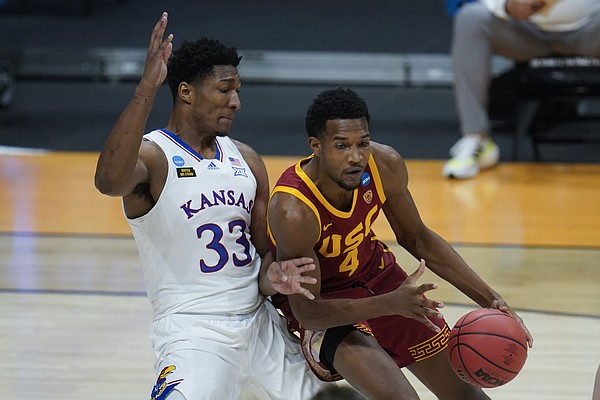 Kansas forward David McCormack (33) guards USC forward Evan Mobley (4) during the first half of a men's college basketball game in the second round of the NCAA tournament at Hinkle Fieldhouse in Indianapolis, Monday, March 22, 2021. (AP Photo/Paul Sancya)