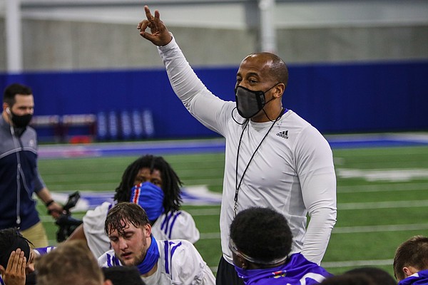 Kansas football interim head coach Emmett Jones addresses the Jayhawks at the team's indoor practice facility on March 30, 2021, the first day of KU's spring practice schedule.