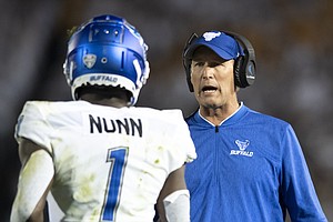 Buffalo head coach Lance Leipold talks with wide receiver Antonio Nunn (1) during the second quarter of an NCAA college football game against Penn State in State College, Pa., on Saturday, Sept. 7, 2019. (AP Photo/Barry Reeger)