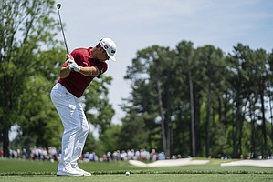 Gary Woodland tees off on the fourth hole during the fourth round of the Wells Fargo Championship golf tournament at Quail Hollow on Sunday, May 9, 2021, in Charlotte, N.C. 


