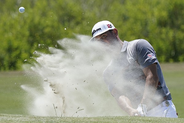 Gary Woodland hits out of a bunker to the fourth green during the final round at the PGA Championship golf tournament on the Ocean Course, Sunday, May 23, 2021, in Kiawah Island, S.C. 