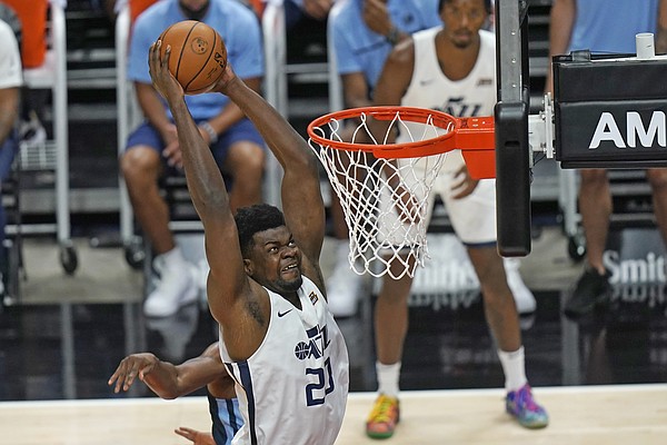 Utah Jazz's Udoka Azubuike (20) dunks against the Memphis Grizzlies during the first half of an NBA summer league basketball game Wednesday, Aug. 4, 2021, in Salt Lake City. 

