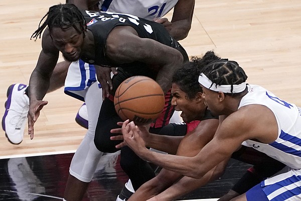 Golden State Warriors guard Moses Moody, right, competes for the ball against against Miami Heat's Marcus Garrett, left and Dru Smith, center, during the second half of a California Classic NBA summer league basketball game in Sacramento, Calif., Wednesday, Aug. 4, 2021. 


