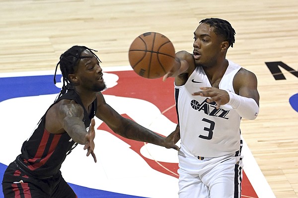 Utah Jazz guard Trent Forrest (3) passes the ball away from Miami Heat guard Marcus Garrett during the first half of an NBA summer league basketball game Friday, Aug. 13, 2021, in Las Vegas.
