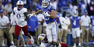 Duke wide receiver Jake Bobo (19) runs the ball while Kansas safety O.J. Burroughs (5) tackles during the second half of an NCAA college football game in Durham, N.C., Saturday, Sept. 25, 2021. (AP Photo/Gerry Broome)


