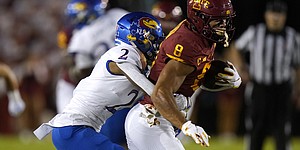 Iowa State wide receiver Xavier Hutchinson (8) tries to break a tackle by Kansas cornerback Jacobee Bryant (2) after catching a pass during the first half of an NCAA college football game, Saturday, Oct. 2, 2021, in Ames, Iowa. (AP Photo/Charlie Neibergall)
