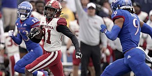 Oklahoma wide receiver Trevon West (81) runs for a first down during the second half of an NCAA college football game against Kansas Saturday, Oct. 23, 2021, in Lawrence, Kan. Oklahoma won 35-23. (AP Photo/Charlie Riedel)
