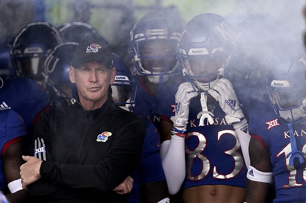 Kansas head coach Lance Leipold waits to lead his team onto the field before an NCAA college football game against Oklahoma Saturday, Oct. 23, 2021, in Lawrence, Kan. (AP Photo/Charlie Riedel)