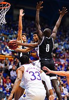 Kansas guard Ochai Agbaji (30) cuts through two defenders for a bucket during the first half on Wednesday, Nov. 3, 2021 at Allen Fieldhouse.