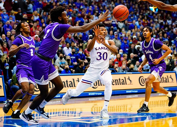 Kansas guard Ochai Agbaji (30) whips a pass to the wing through the Tarleton State defense during the first half on Friday, Nov. 12, 2021 at Allen Fieldhouse.