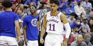 Kansas guard Remy Martin celebrates a defensive stop against North Texas during the first half of a NCAA college basketball game Thursday, Nov. 25, 2021, in Orlando, Fla. 