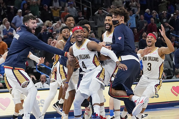 New Orleans Pelicans guard Devonte' Graham (4) celebrates with teammates after hitting the game winning basket to end the second half of an NBA basketball game against the Oklahoma City Thunder, Wednesday, Dec. 15, 2021, in Oklahoma City. (AP Photo/Sue Ogrocki)


