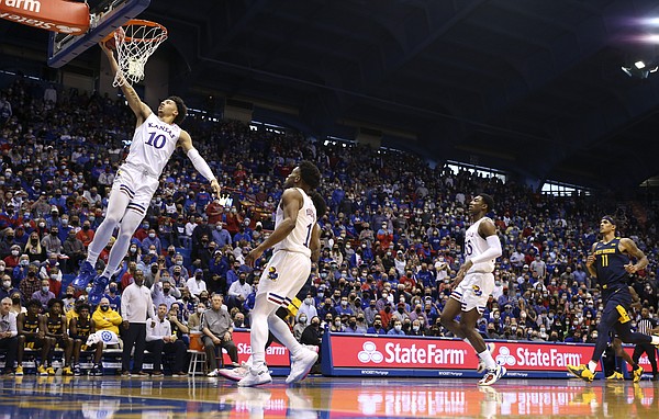 Kansas forward Jalen Wilson (10) gets in for a bucket against West Virginia during the first half on Saturday, Jan. 15, 2022 at Allen Fieldhouse.