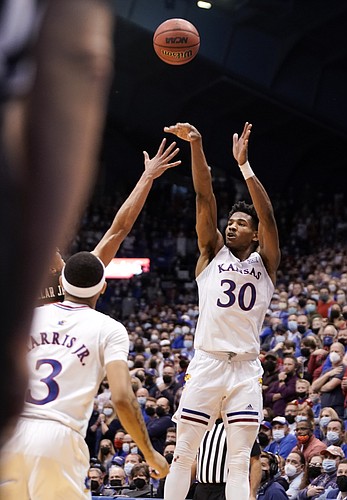 Kansas guard Ochai Agbaji (30) puts up a three pointer to force double overtime on Monday, Jan. 24, 2022 at Allen Fieldhouse.