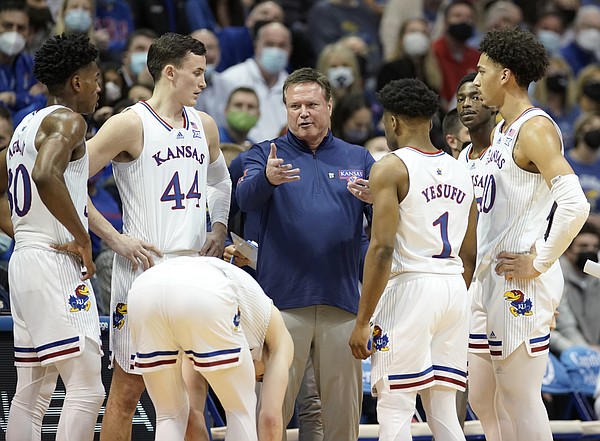 Kansas head coach Bill Self regroups with the Jayhawks during a timeout in the first half on Saturday, Feb. 12, 2022 at Allen Fieldhouse.