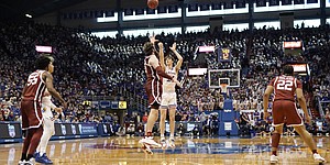 Kansas forward Zach Clemence (21) puts a three up over Oklahoma forward Tanner Groves (35) during the second half on Saturday, Feb. 12, 2022 at Allen Fieldhouse.