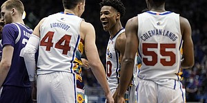 Kansas guard Ochai Agbaji (30) celebrates with Kansas forward Mitch Lightfoot (44) after a dunk by Lightfoot against Kansas State during the second half on Tuesday, Feb. 22, 2022 at Allen Fieldhouse.
