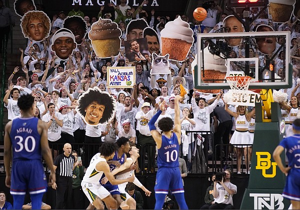 Kansas forward Jalen Wilson (10) shoots a free throw with the Baylor student section in the background during the second half of an NCAA college basketball game Saturday, Feb. 26, 2022, in Waco, Texas.