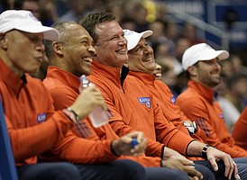 Kansas head coach Bill Self and his staff smile as they listen to the senior speeches.