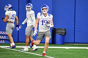 Linebacker Gavin Potter goes through drills during the Kansas football team's spring practice on March 8, 2022.