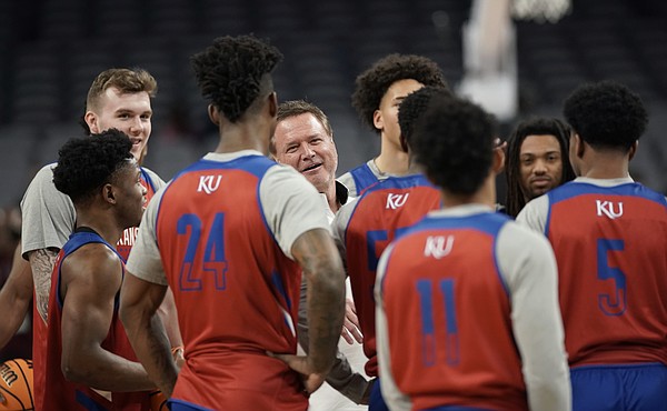 Kansas head coach Bill Self talks with his players at half court on Wednesday, March 16, 2022 at Dickies Arena in Fort Worth, Texas.