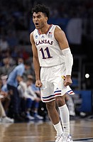 Kansas guard Remy Martin (11) celebrates a run by the Jayhawks during the second half on Saturday, March 19, 2022 at Dickies Arena in Fort Worth, Texas. The Jayhawks advanced to the Sweet 16 with a 79-72 win over the Bluejays.