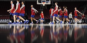 Kansas players get warmed up at the start of practice on Thursday, March 24, 2022 at United Center in Chicago.
