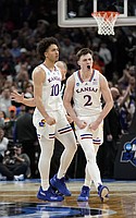 Kansas guard Christian Braun (2) celebrates before Kansas forward Jalen Wilson (10) after hitting a three against Miami during the second half on Sunday, March 27, 2022 at United Center in Chicago. The Jayhawks defeated the Hurricanes, 76-50 to advance to the Final Four.