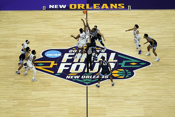 Villanova and Kansas tip off their college basketball game during the semifinal round of the Men's Final Four NCAA tournament, Saturday, April 2, 2022, in New Orleans. (AP Photo/David J. Phillip)