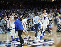 Kansas forward Jalen Wilson (10) skips off the court as the Kansas Jayhawks celebrate their 72-69 win over North Carolina in the NCAA National Championship game on Monday, April 4, 2022 at Caesars Superdome in New Orleans.