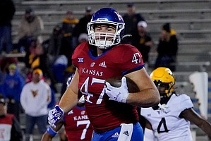 Kansas fullback Jared Casey catches the ball for a touchdown during a college football game against West Virginia on Nov. 27, 2021, in Lawrence, Kan.