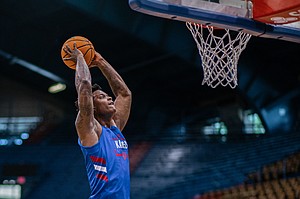 Forward KJ Adams Jr. goes for a dunk during the team scrimmage at the annual Bill Self Basketball Camp on Wednesday, June 8, 2022 at Allen Fieldhouse on Wednesday, June 8, 2022 at Allen Fieldhouse. 
