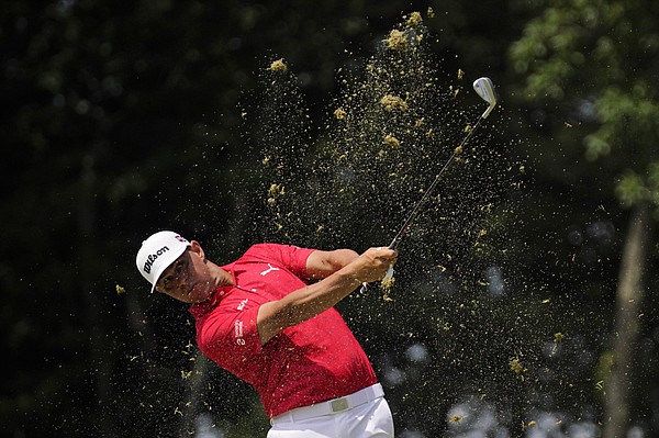 Gary Woodland watches his shot on the 11th hole during the second round of the U.S. Open golf tournament at The Country Club, Friday, June 17, 2022, in Brookline, Mass. (AP Photo/Robert F. Bukaty)