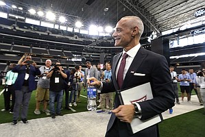 Incoming Big 12 Commissioner Brett Yormark walks after speaking at the NCAA college football Big 12 media days in Arlington, Texas, Wednesday, July 13, 2022. (AP Photo/LM Otero)
