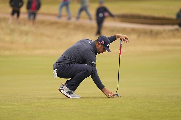 Gary Woodland of the US sets up his putt on the 10th green during the second round of the British Open golf championship on the Old Course at St. Andrews, Scotland, Friday July 15, 2022. The Open Championship returns to the home of golf on July 14-17, 2022, to celebrate the 150th edition of the sport's oldest championship, which dates to 1860 and was first played at St. Andrews in 1873. (AP Photo/Gerald Herbert)


