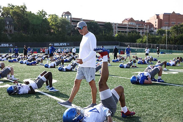 Kansas coach Lance Leipold talks to redshirt sophomore Cornell Wheeler (44) during the first day of practice on Tuesday, Aug. 2, 2022.