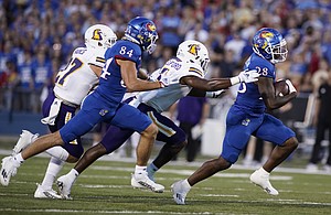 Kansas running back Sevion Morrison (28) takes off up the field past the Tennessee Tech defense during the second quarter on Friday, Sept. 2, 2022 at Memorial Stadium.