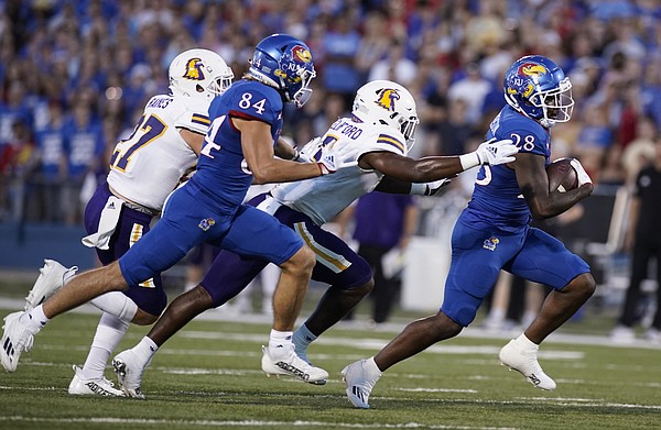 Kansas running back Sevion Morrison (28) takes off up the field past the Tennessee Tech defense during the second quarter on Friday, Sept. 2, 2022 at Memorial Stadium.