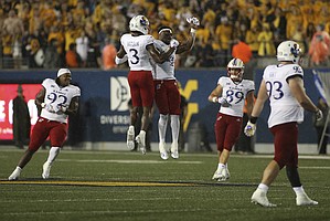 Kansas players celebrate during overtime of an NCAA college football game against West Virginia in Morgantown, W.Va., Saturday, Sept. 10, 2022. (AP Photo/Kathleen Batten)


