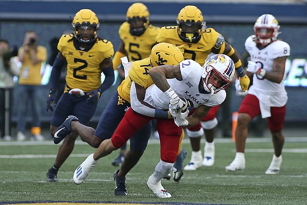 Kansas wide receiver Lawrence Arnold (2) is defended by West Virginia Mountaineers safety Malachi Ruffin (14) during the first half of an NCAA college football game in Morgantown, W.Va., Saturday, Sept. 10, 2022. (AP Photo/Kathleen Batten)