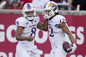 Kansas running back Torry Locklin (12) celebrates after his touchdown with Ky Thomas during the first half of an NCAA college football game against Houston, Saturday, Sept. 17, 2022, in Houston. (AP Photo/Eric Christian Smith)


