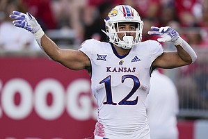 Kansas running back Torry Locklin celebrates after his touchdown during the first half of an NCAA college football game against Houston, Saturday, Sept. 17, 2022, in Houston. (AP Photo/Eric Christian Smith)