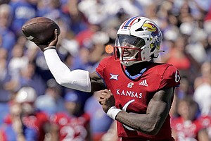 Kansas quarterback Jalon Daniels throws during the second half of an NCAA college football game against Duke Saturday, Sept. 24, 2022, in Lawrence, Kan. (AP Photo/Charlie Riedel)