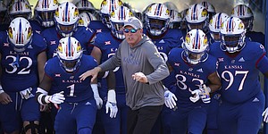 Kansas head coach Lance Leipold and the Jayhawks storm out of the tunnel to take the field before kickoff against Iowa State on Saturday, Oct. 1, 2022 at Memorial Stadium.