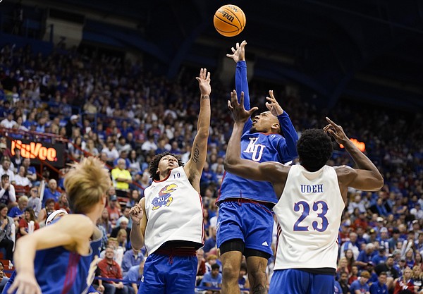 Kansas guard Bobby Pettiford Jr. (0) puts up a floater over Kansas forward Jalen Wilson (10) and Kansas center Ernest Udeh Jr. (23) during Late Night in the Phog on Friday, Oct. 14, 2022 at Allen Fieldhouse.