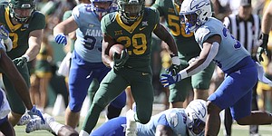 Baylor running back Richard Reese runs through the Kansas defense in the first half of an NCAA college football game, Saturday, Oct. 22, 2022, in Waco, Texas. (AP Photo/Jerry Larson)


