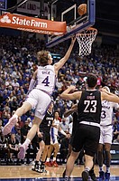Kansas guard Gradey Dick (4) tosses a shot from under the bucket against Omaha during the first half, Monday, Nov. 7, 2022 at Allen Fieldhouse.