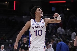 Kansas forward Jalen Wilson (10) reacts to a scar against Duke during the second half of an NCAA college basketball game, Wednesday, Nov. 16, 2022, in Indianapolis. (AP Photo/Darron Cummings)


