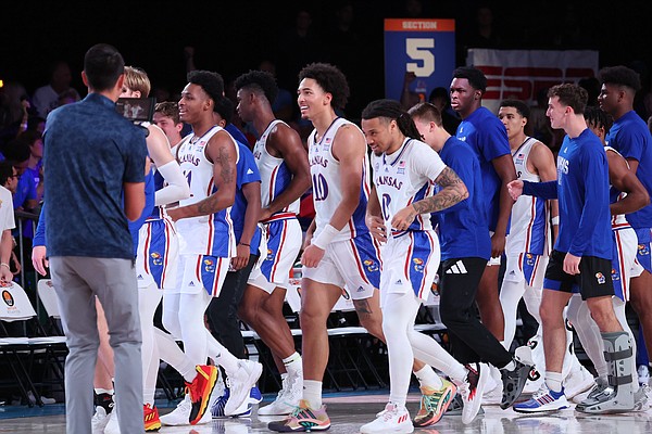 The Jayhawks line up to shake hands with Wisconsin after Bobby Pettiford (0) hit a wild shot to win it with 0.2 seconds to play in overtime at the Bad Boy Mower’s Men’s Battle 4 Atlantis at Atlantis, Paradise Island in The Bahamas. (Photo by Tim Aylen)